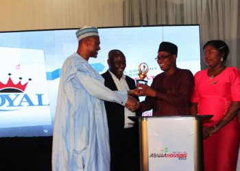 West African Ceramics Ltd (2nd right) receives award from Umar Shuaibu